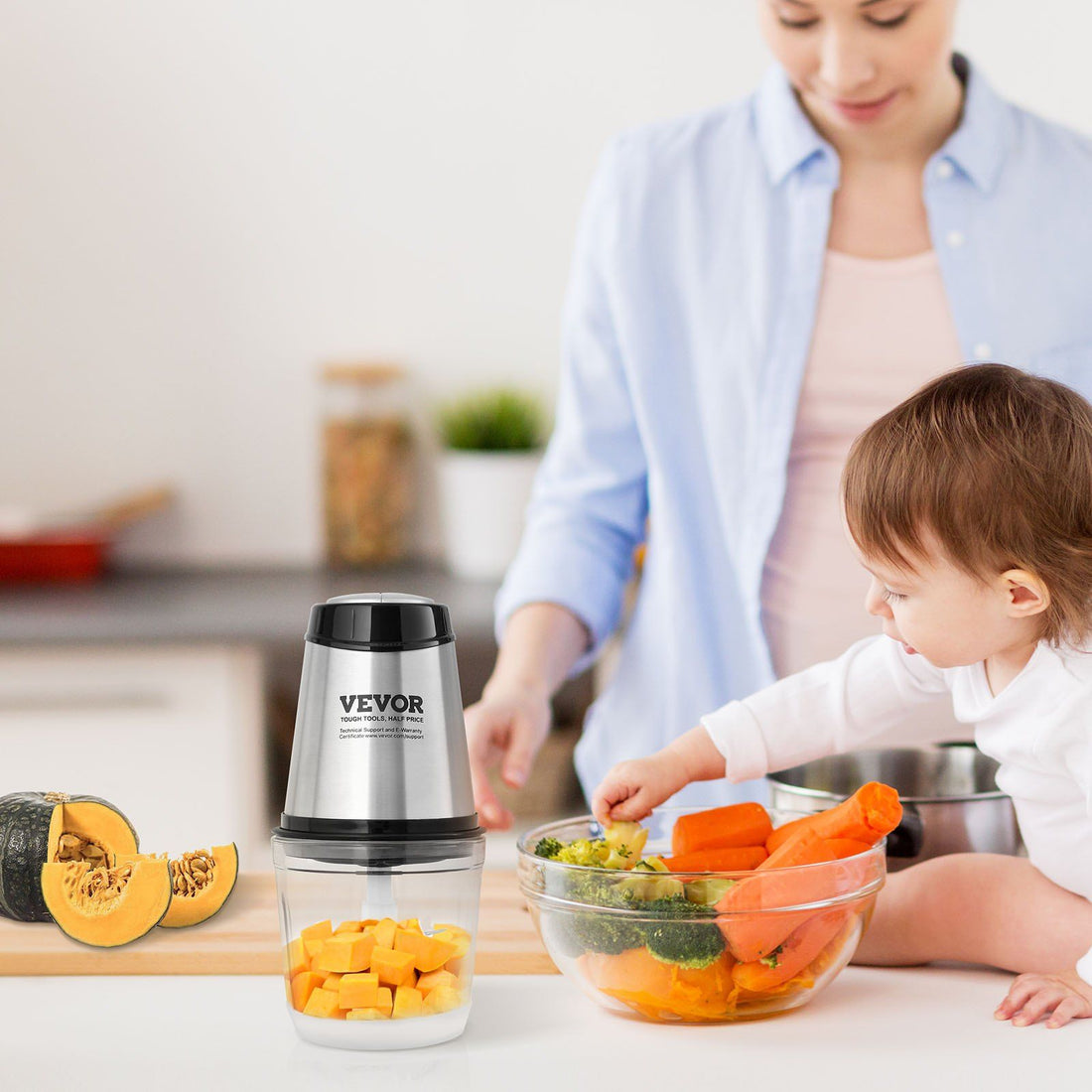Electric food processor meat grinder with chopped vegetables in the bowl
