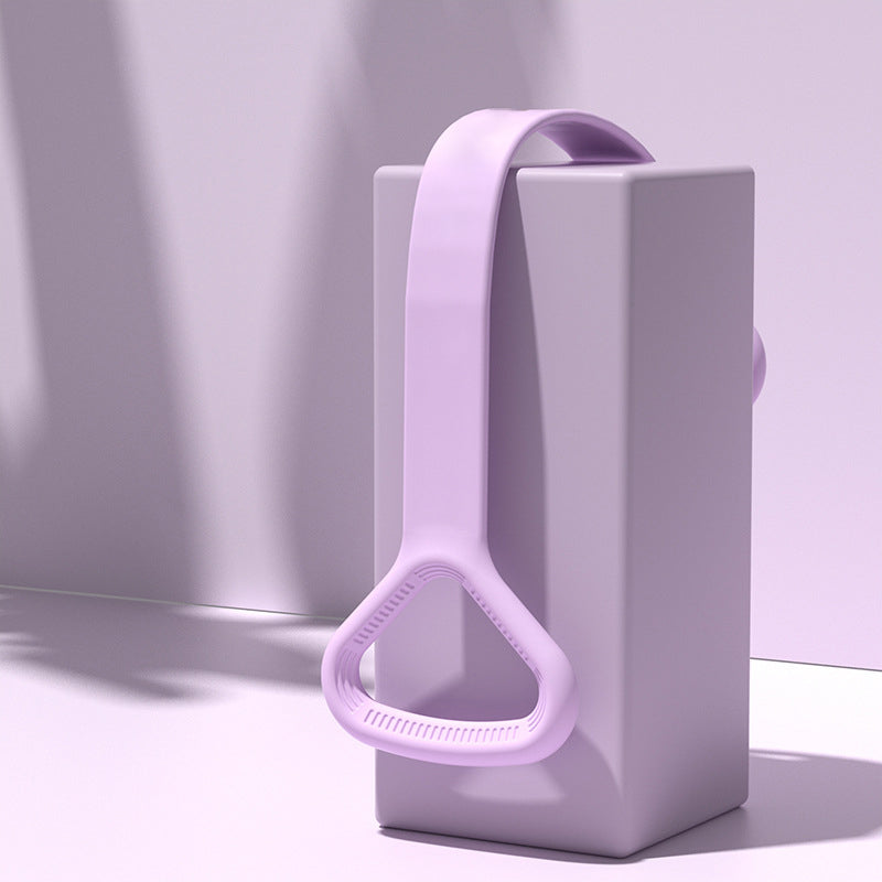 Purple yoga band draped over a display block showing the handle and material