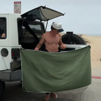 Magnetic changing towel attached to car