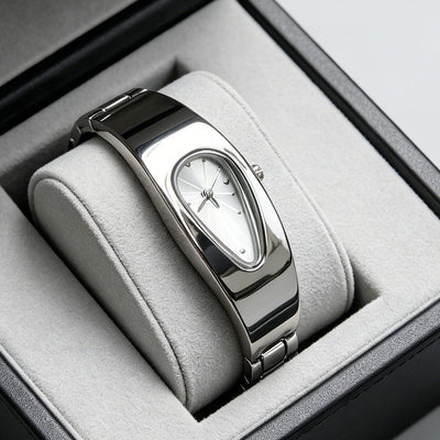 Silver and white water drop watch on jewelry display stand, side angle