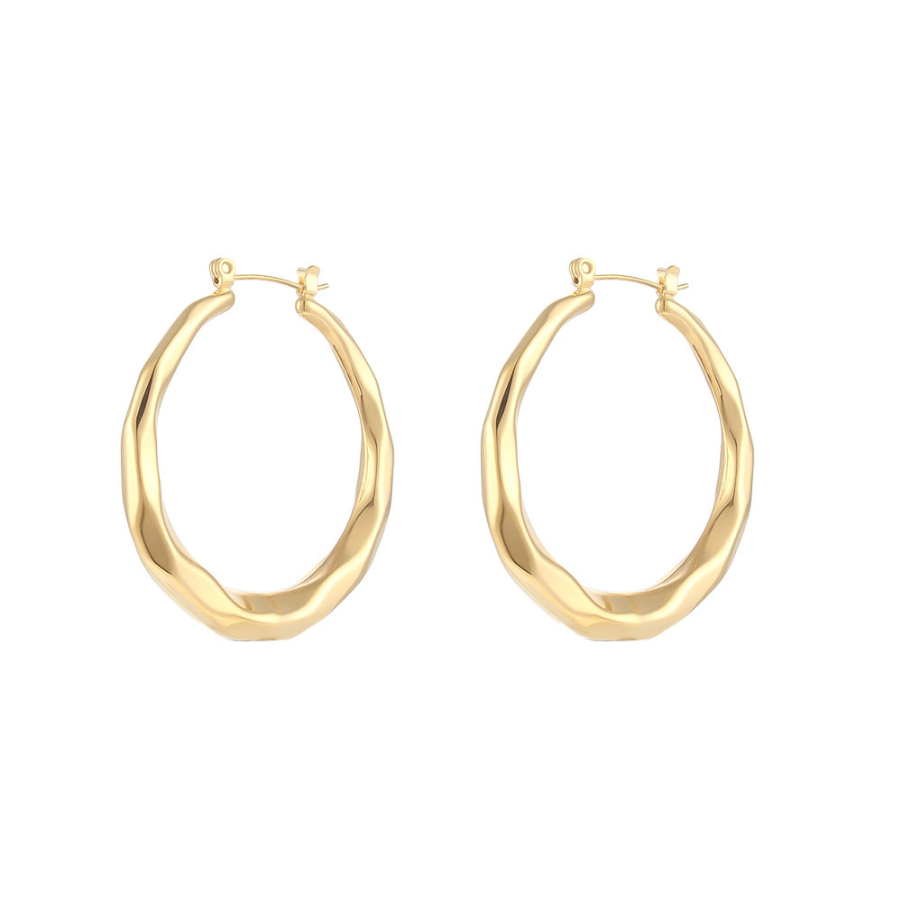 Two gold-tone titanium steel hoop earrings with a twisted, rope-like texture