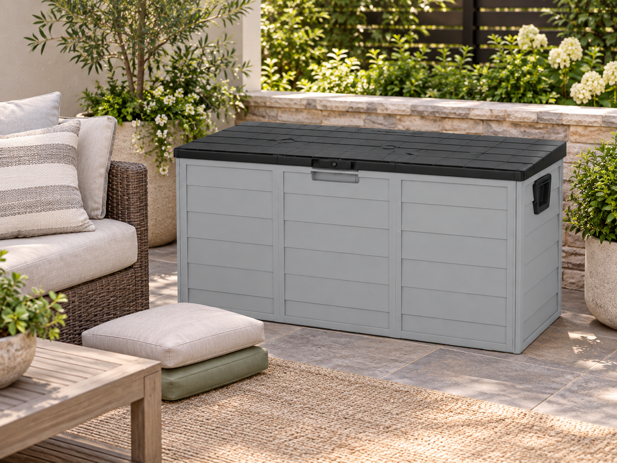 Gray 75-gallon patio storage box beside outdoor seating and cushions