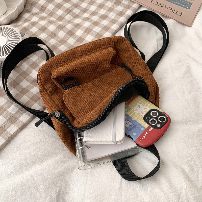 Women's corduroy mini backpack, open interior view
