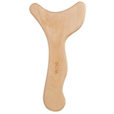 Wood massage tool used on the thigh for lymphatic drainage