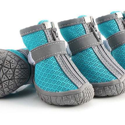 Teal mesh dog boots with a gray strap and gripping sole