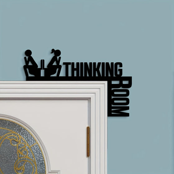 Thinking Room metal sign on a door frame against a blue wall