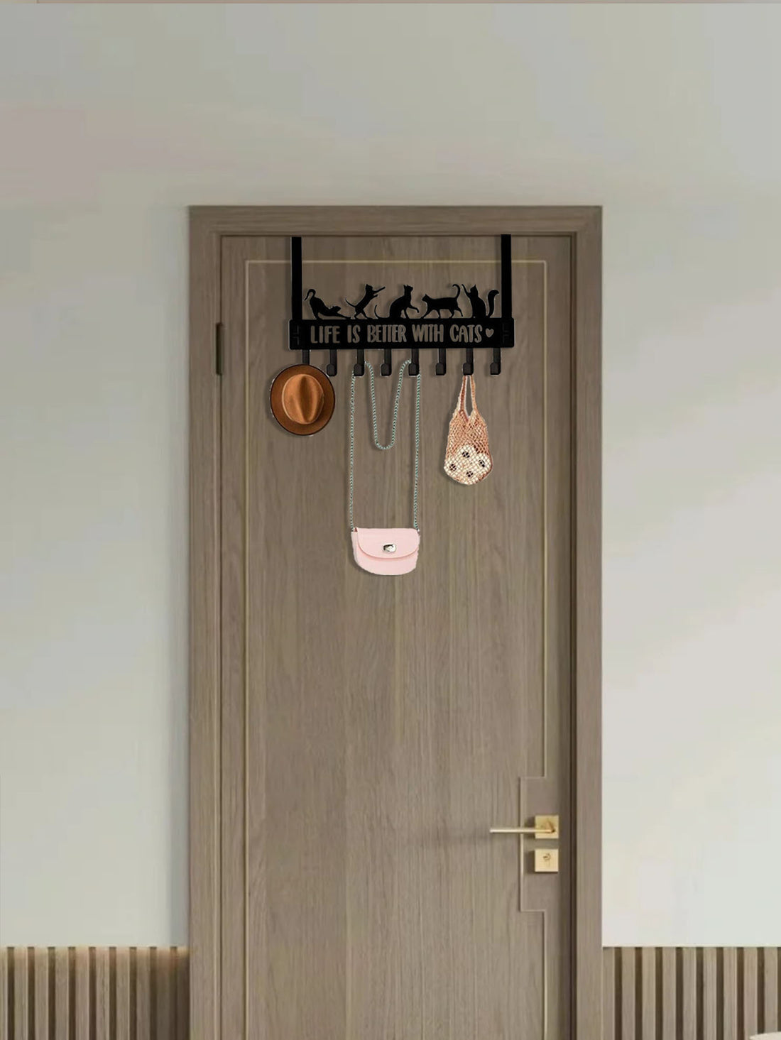 Cat hook rack over a brown door