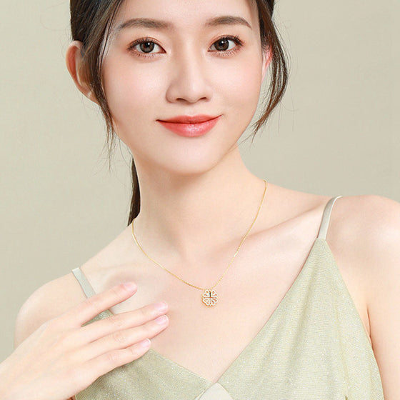 Model wearing the four-leaf clover pendant