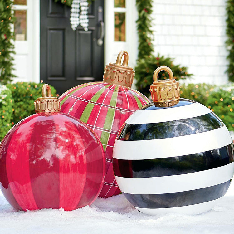 Red striped and black striped 60cm inflatable Christmas balls on a porch