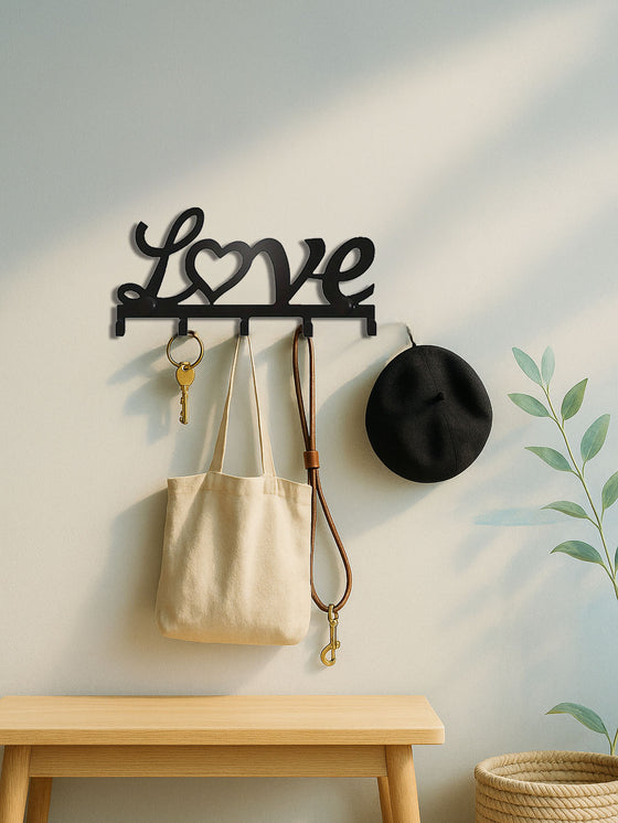 Love key holder holding bags and a hat