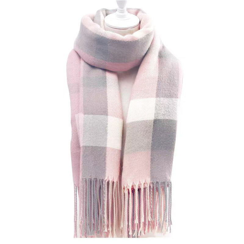 Pink and cream plaid tassel scarf folded on a white background