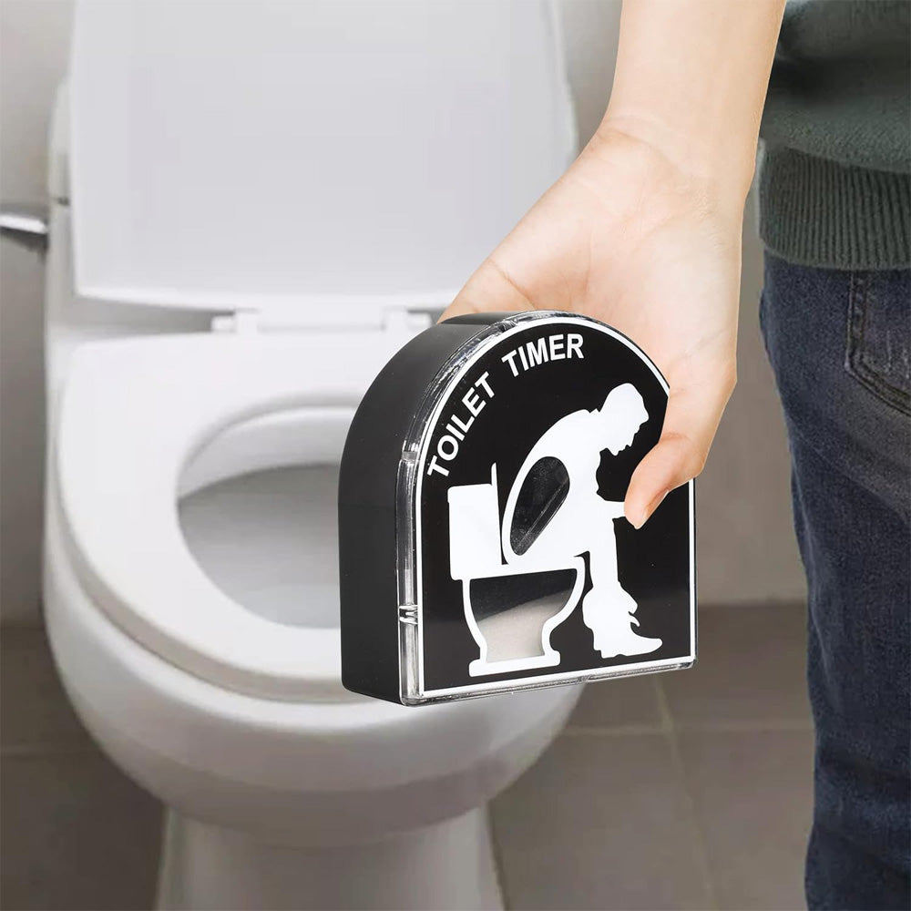Hand placing the toilet hourglass timer on a toilet seat
