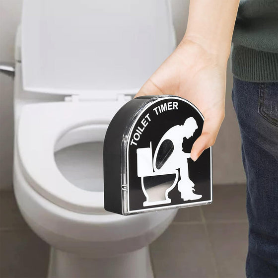 Hand placing the toilet hourglass timer on a toilet seat