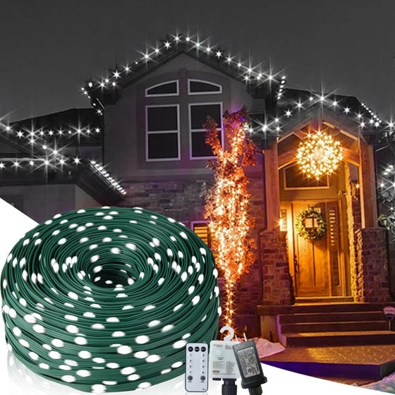 House roofline and porch outlined with 1000 LED outdoor Christmas string lights, green wire coil inset