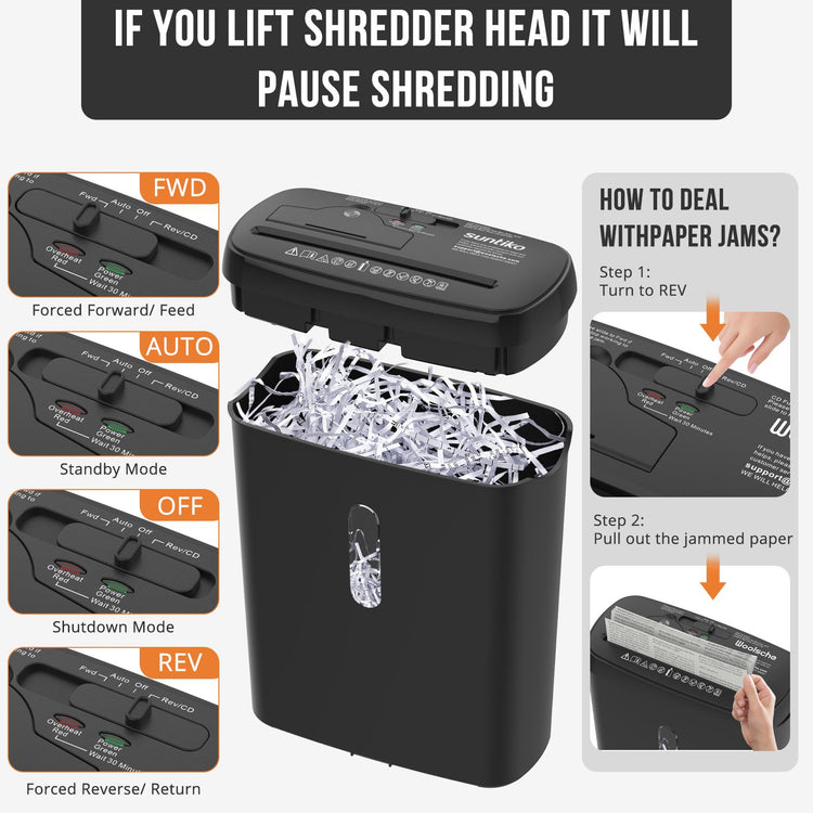 Paper shredder in use beside a home office desk