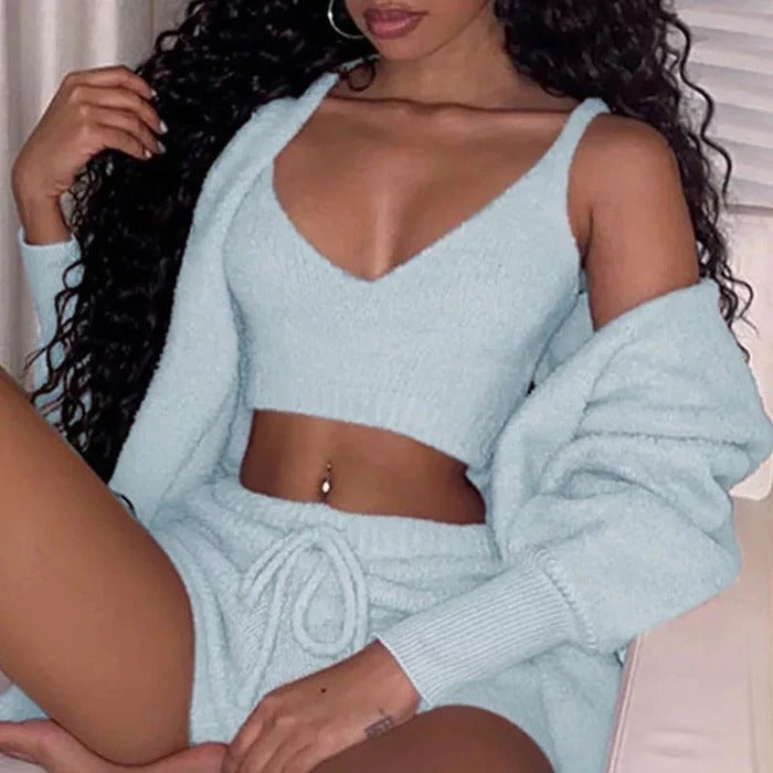 Women's 3-piece fleece pajama set in light blue, worn with hooded top and shorts