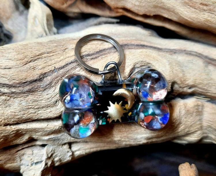 Shungite and Black Tourmaline dog bone charm, close-up