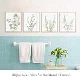 Four botanical canvas panels laid out flat