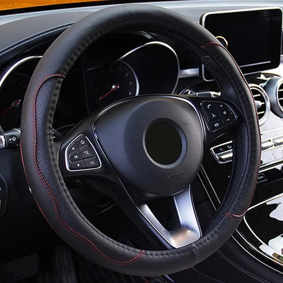 Black steering wheel cover fitted on a car steering wheel