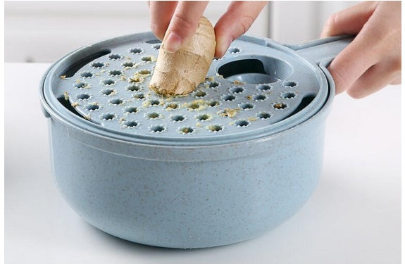 Mandoline slicer with built-in strainer bowl