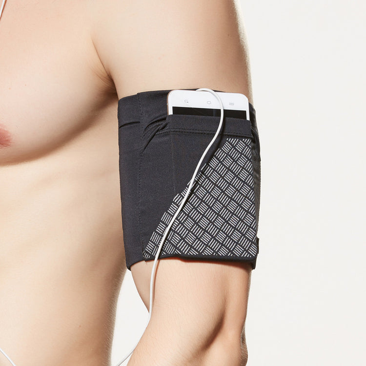 Phone arm pocket strapped around a forearm during a run