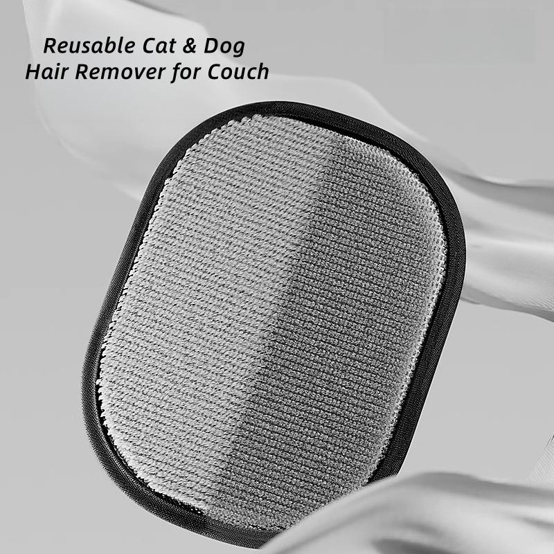 Cat being groomed with silicone pet hair removal glove
