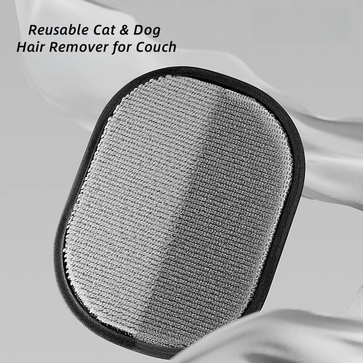 Cat being groomed with silicone pet hair removal glove