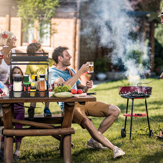 Family at an outdoor BBQ with the grill caddy