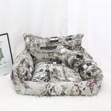 Small dog curled up on the armchair pet bed's plush cushion
