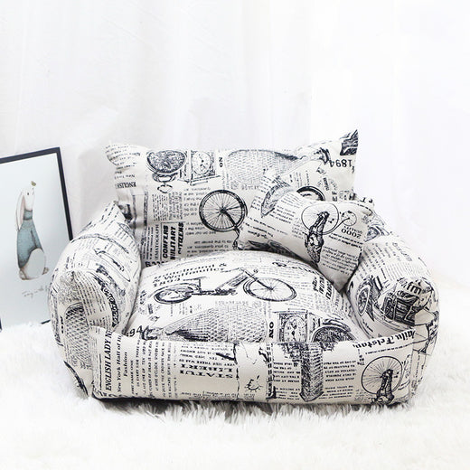 Armchair-style pet bed shown from the front with cushioned seat