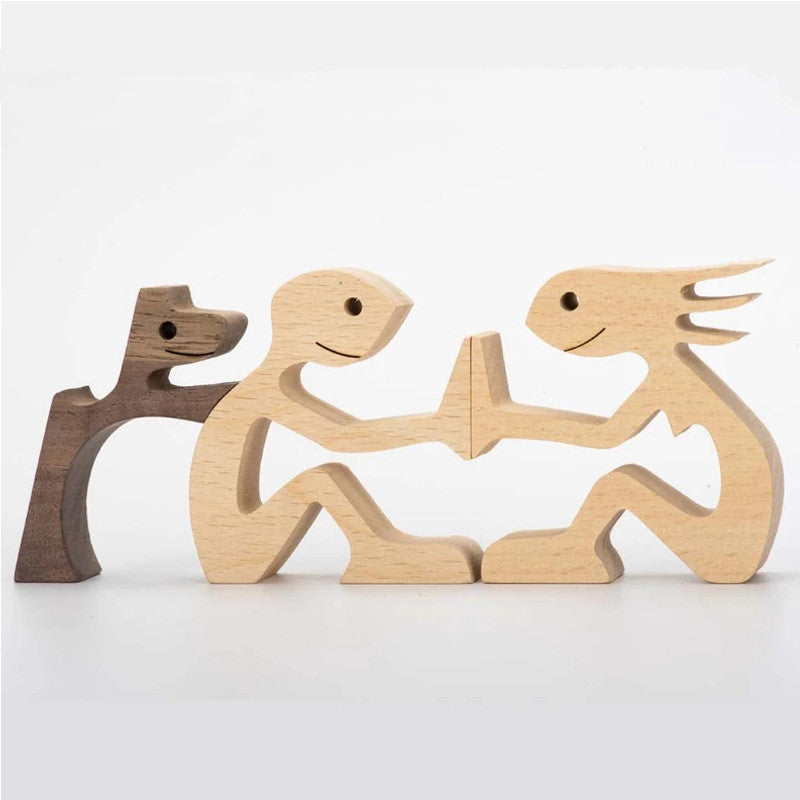 Wood carving of a couple with their dog, light natural wood
