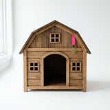 Cat resting inside the barn pet house entrance