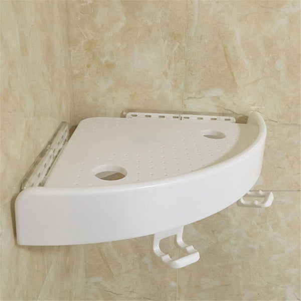 White corner shelf with hooks on a tiled wall