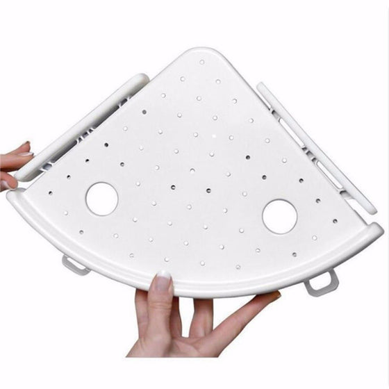 Hands holding the white corner shelf