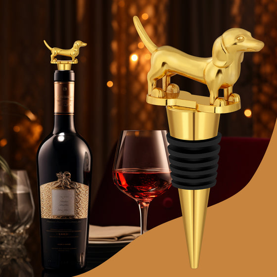 Gold dachshund bottle stopper beside a wine bottle and glass