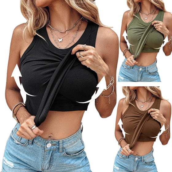 Woman in a black tank top lifting the hem to show the built-in bra layer