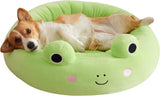 Small dog resting with head propped on the bed's rim