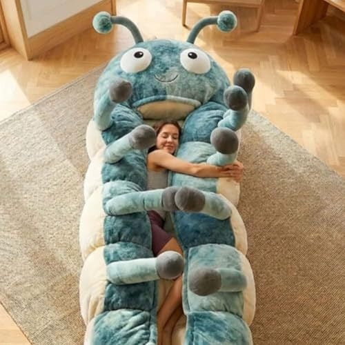 Woman hugging a blue plush caterpillar sleeping bag on a tatami floor