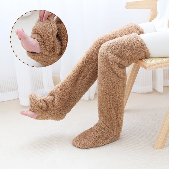 Brown over-the-knee fuzzy socks worn on a chair, with a close-up of the plush pile