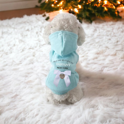 Blue dog hoodie with heart charm bow, flat lay