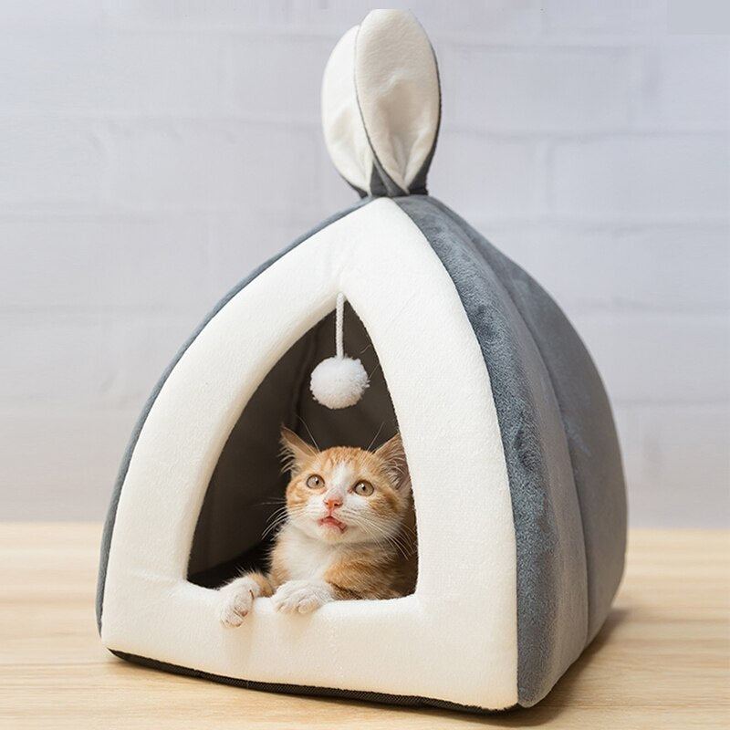 Bunny-shaped pet house with the ear-flap entrance visible