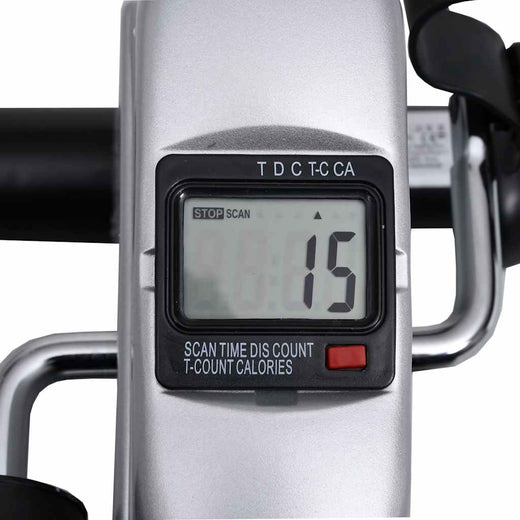 Pedal bike trainer compact size next to a chair