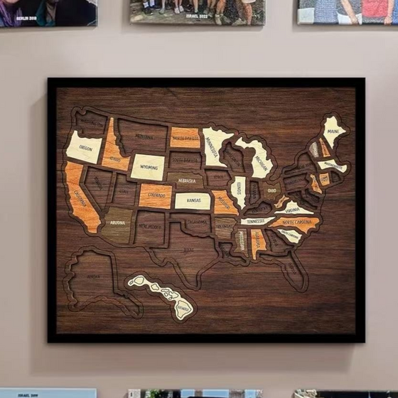 Framed wooden USA map hung on a wall