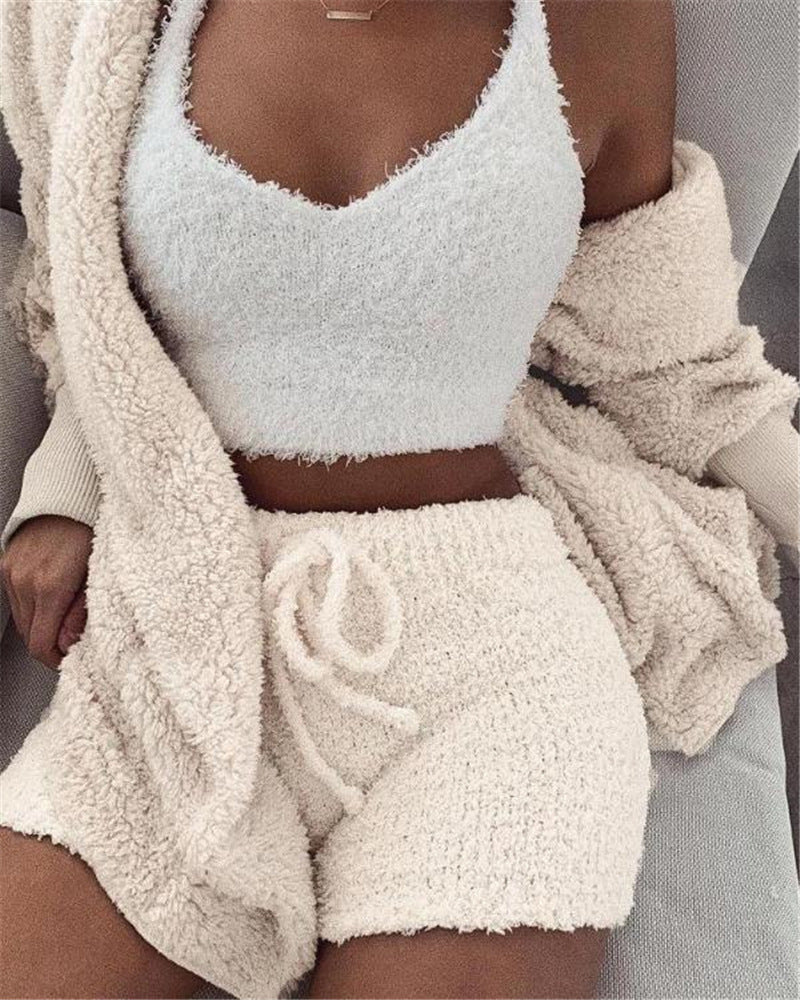 Women's 3-piece fleece pajama set in cream white, hooded top open over tank and shorts