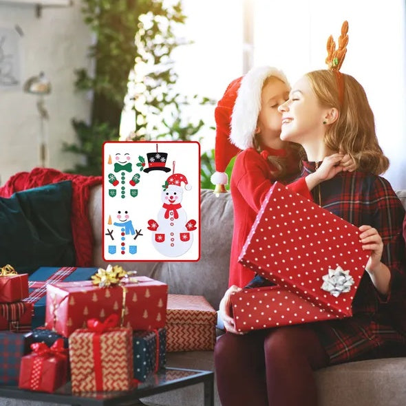 Girl with a red gift beside a DIY felt snowman hung on a door
