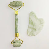 White Jade Roller and Gua Sha Set, in use during facial massage