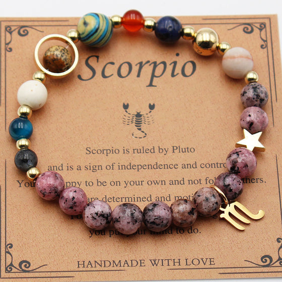 Scorpio zodiac bracelet on its card, sign for reference