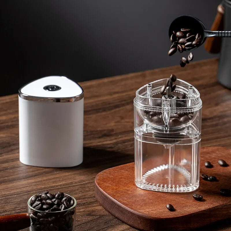 Portable USB coffee grinder held in hand