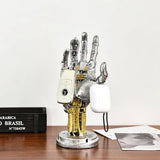 Close-up of the sculpted silver finish on the mechanical hand stand