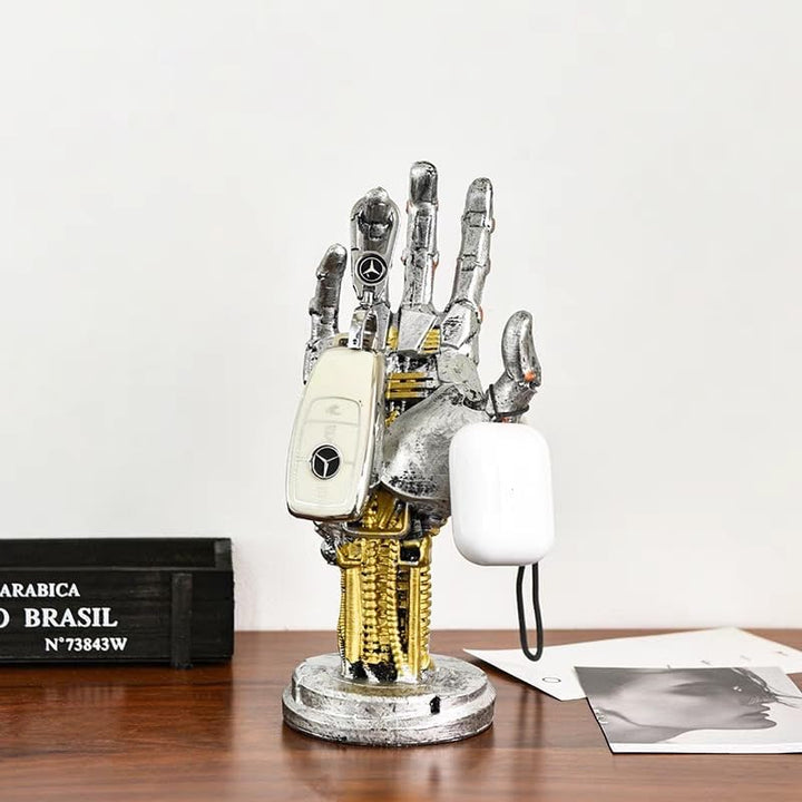 Close-up of the sculpted silver finish on the mechanical hand stand